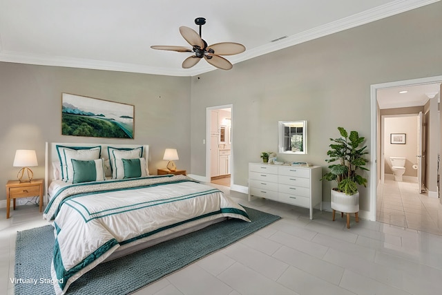 bedroom featuring ceiling fan, crown molding, and ensuite bathroom