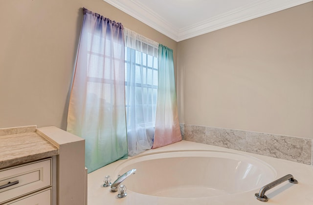 bathroom with ornamental molding, vanity, and a tub