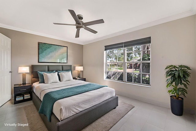 bedroom with ornamental molding and ceiling fan