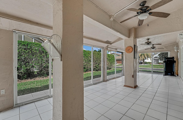 exterior space featuring ceiling fan