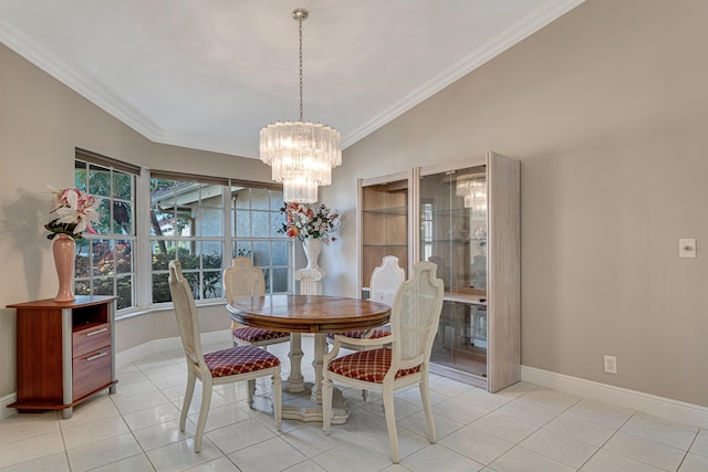 dining area featuring a notable chandelier, ornamental molding, and light tile patterned floors