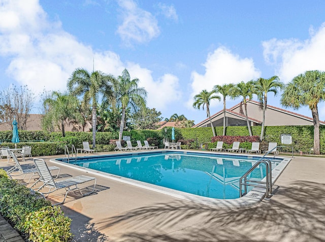 view of swimming pool with a patio