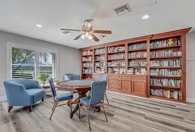 dining area featuring ceiling fan and light wood-type flooring