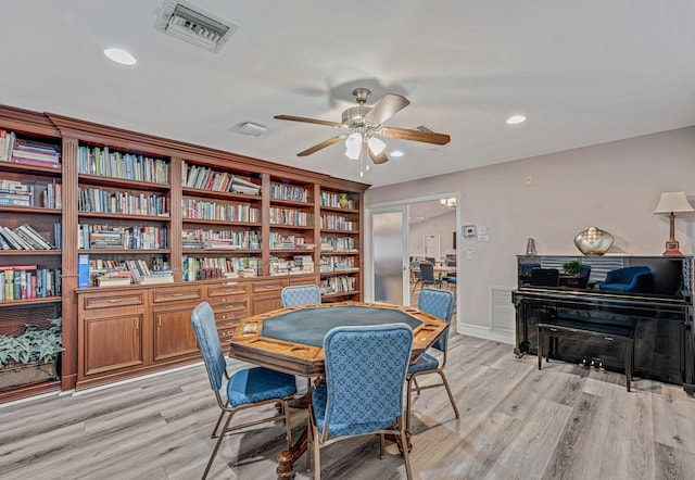 dining room featuring ceiling fan and light hardwood / wood-style floors