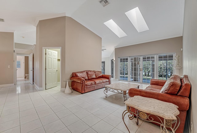 living room featuring ornamental molding, light tile patterned floors, and a skylight