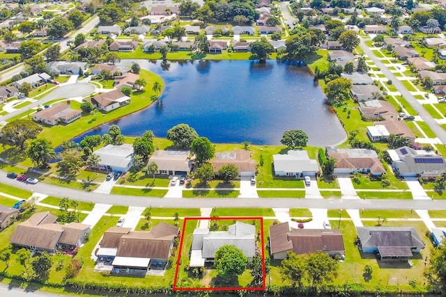 aerial view featuring a residential view and a water view