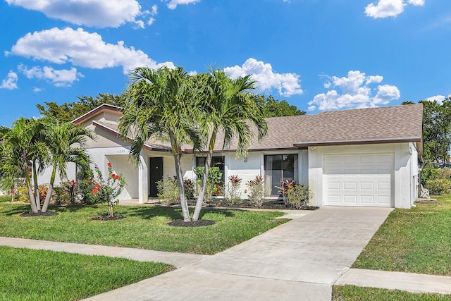 6335 Hitchin Post Way, Delray Beach, FL 33484 - ranch-style home with driveway, a front yard, a garage, and stucco siding