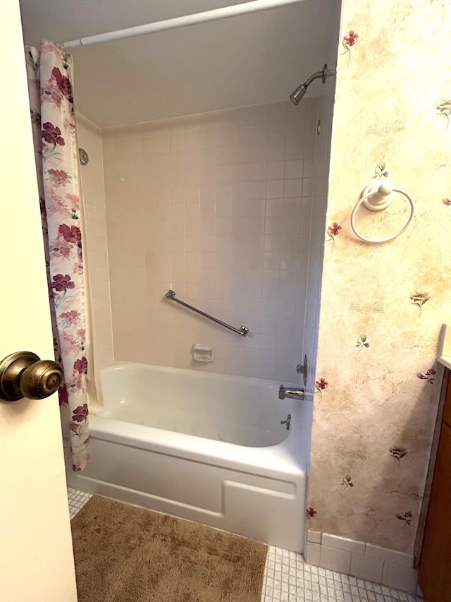 bathroom featuring vanity, shower / bathtub combination with curtain, and tile patterned flooring