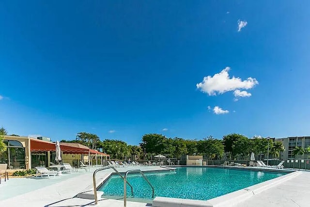 view of swimming pool featuring a patio area