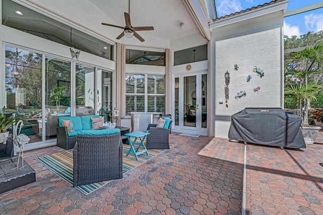 view of patio / terrace with grilling area, outdoor lounge area, french doors, and ceiling fan