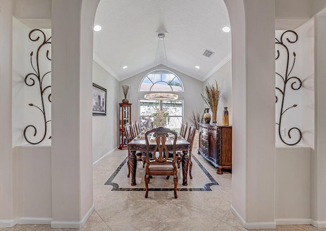 dining room with vaulted ceiling, a chandelier, a textured ceiling, and crown molding