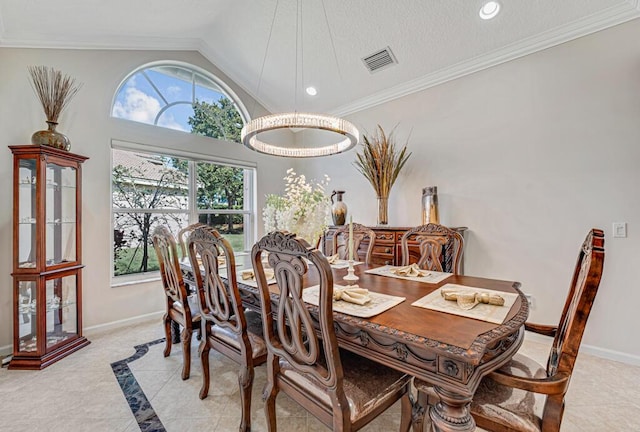 dining space featuring vaulted ceiling and ornamental molding