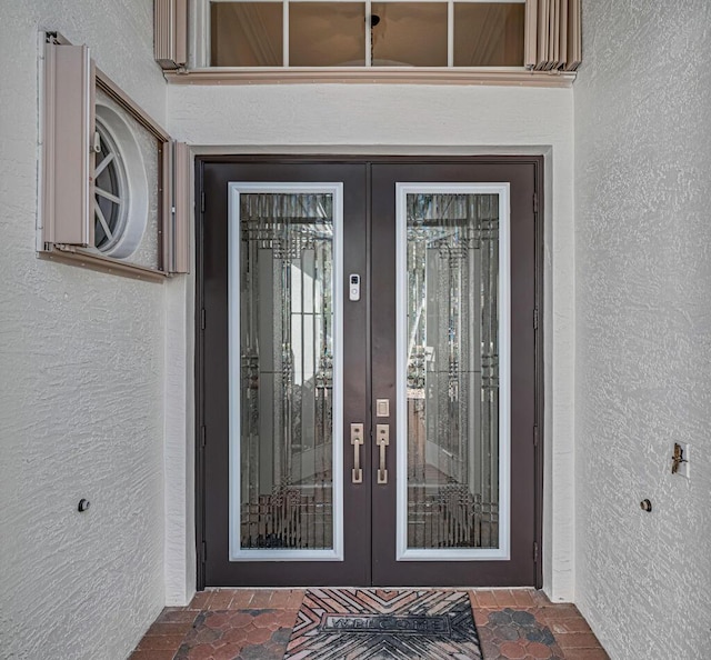 entrance to property featuring french doors