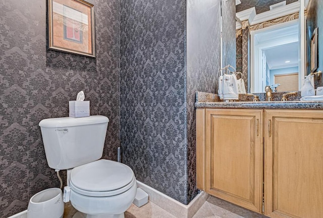 bathroom with vanity, tile patterned floors, and toilet