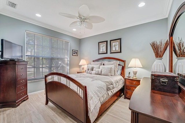 bedroom with ornamental molding, light wood-type flooring, and ceiling fan