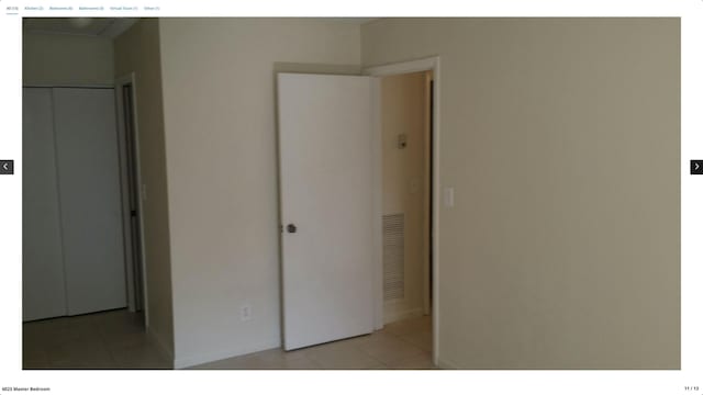 unfurnished bedroom featuring light tile patterned floors