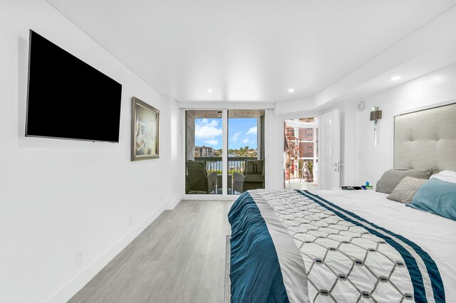 1155 Hillsboro Mile Unit 202, Hillsboro Beach, FL 33062 - bedroom with wood-type flooring and access to outside