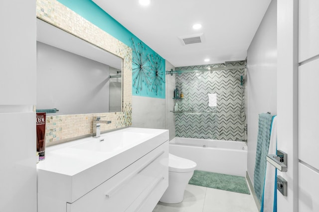 1155 Hillsboro Mile Unit 202, Hillsboro Beach, FL 33062 - full bathroom with tile patterned floors, toilet, tiled shower / bath, tile walls, and vanity