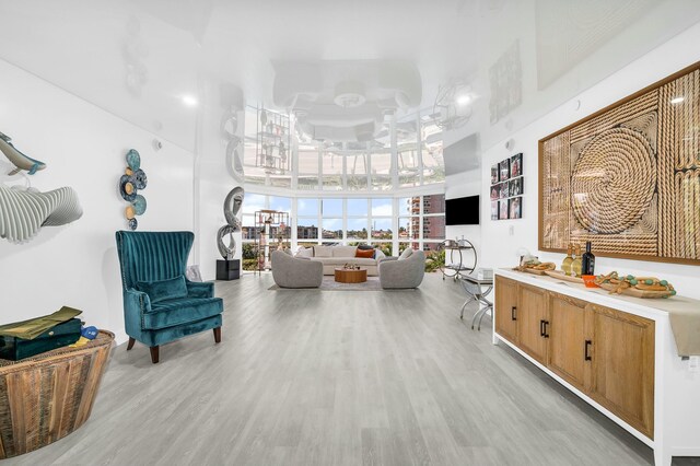 1155 Hillsboro Mile Unit 202, Hillsboro Beach, FL 33062 - sitting room featuring a high ceiling and light hardwood / wood-style floors
