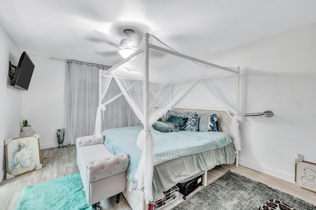 bedroom featuring ceiling fan and hardwood / wood-style floors