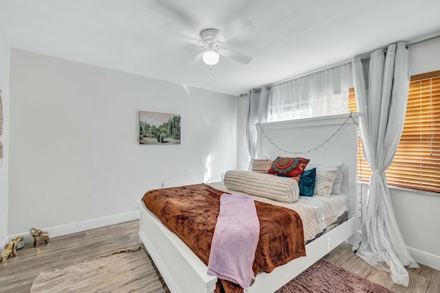 bedroom featuring ceiling fan and light wood-type flooring