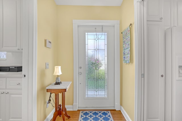 doorway with light hardwood / wood-style flooring