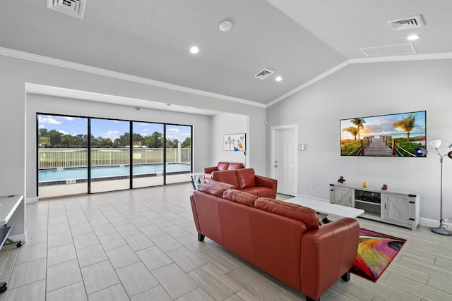 living room with ornamental molding, lofted ceiling, and light wood-type flooring