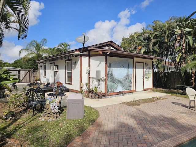 back of property with a patio