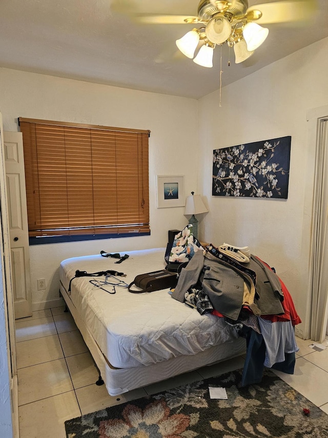 bedroom with light tile patterned flooring and ceiling fan