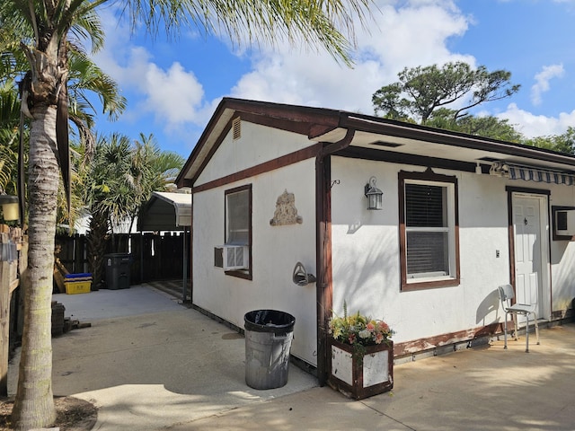 exterior space featuring cooling unit and a patio