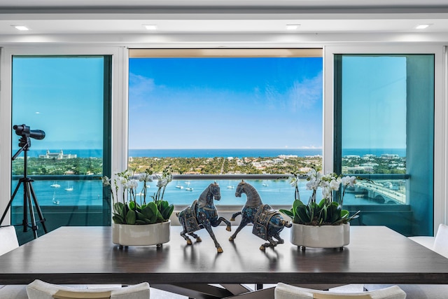 dining area with a water view and plenty of natural light