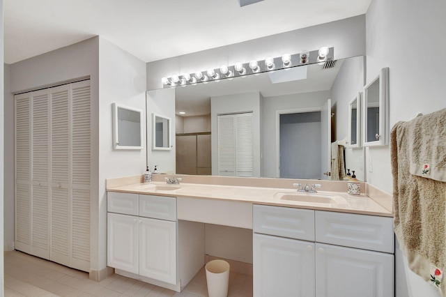 bathroom featuring vanity and walk in shower