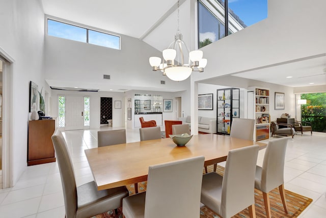 tiled dining space with plenty of natural light and a chandelier