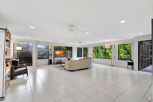 tiled living room with a healthy amount of sunlight