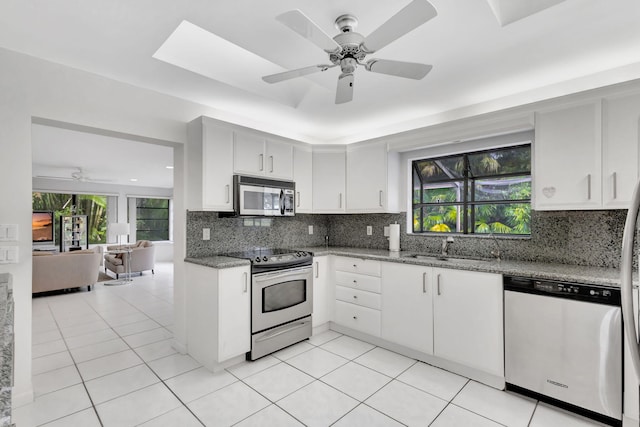 kitchen with white cabinetry, appliances with stainless steel finishes, and sink