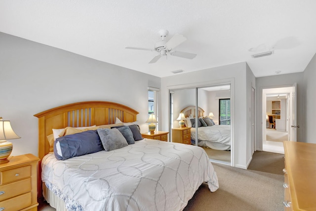 bedroom featuring carpet floors, a closet, and ceiling fan