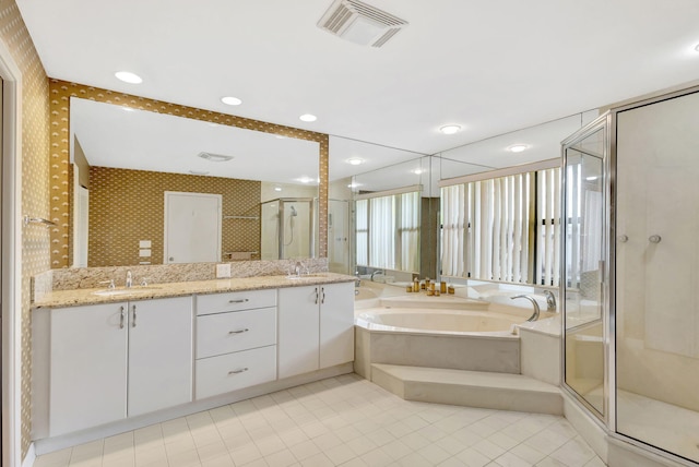 bathroom featuring vanity, tile patterned flooring, and independent shower and bath