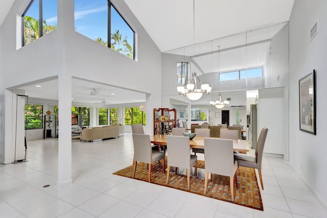 tiled dining area featuring a wealth of natural light and a chandelier