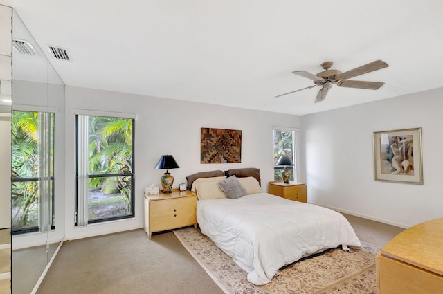 bedroom with light colored carpet and ceiling fan