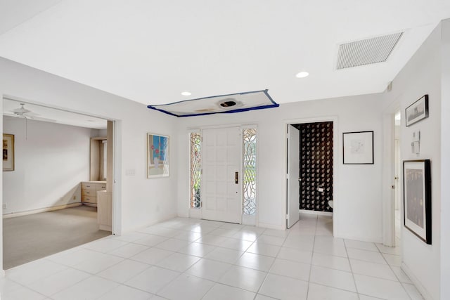 entrance foyer with light tile patterned floors and ceiling fan