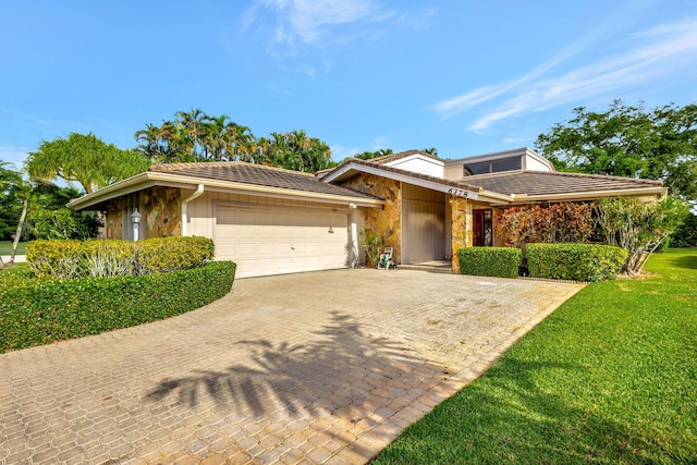 view of front of property with a garage