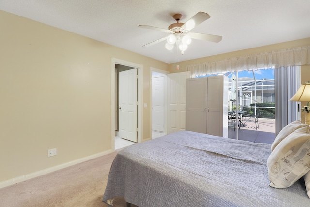 bedroom with light colored carpet, access to exterior, and ceiling fan