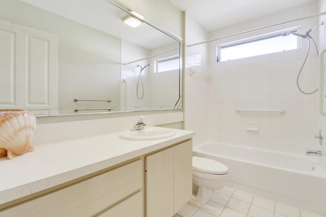 full bathroom with tile patterned floors, toilet, tiled shower / bath combo, and vanity