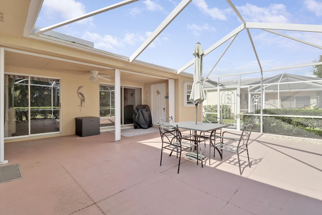 sunroom / solarium featuring ceiling fan