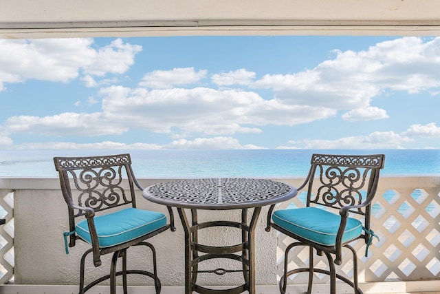 balcony featuring a water view