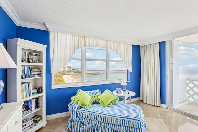 bedroom with crown molding, a water view, and a textured ceiling