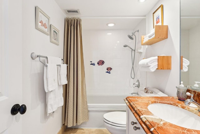 full bathroom featuring shower / tub combo, vanity, and toilet