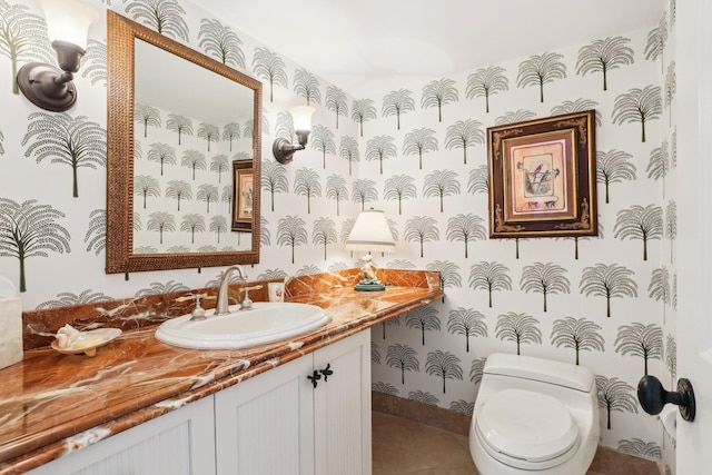 bathroom featuring vanity and toilet