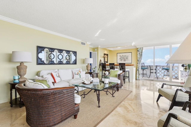 living room featuring expansive windows, ornamental molding, and a textured ceiling