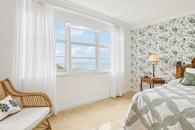 bedroom featuring ornamental molding and light tile patterned floors